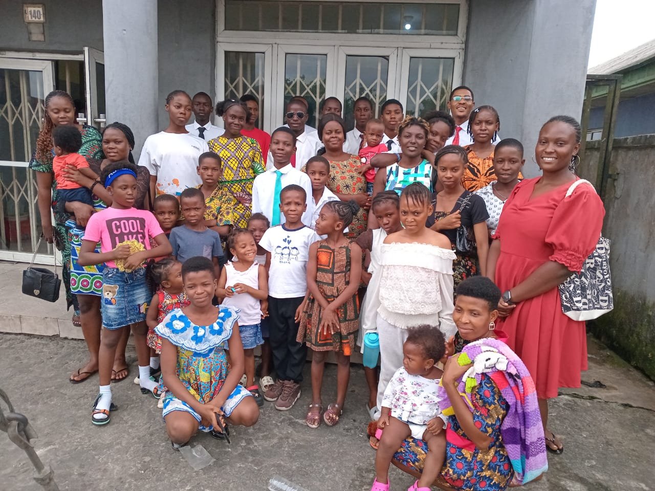 Families standing together outside a church building after services