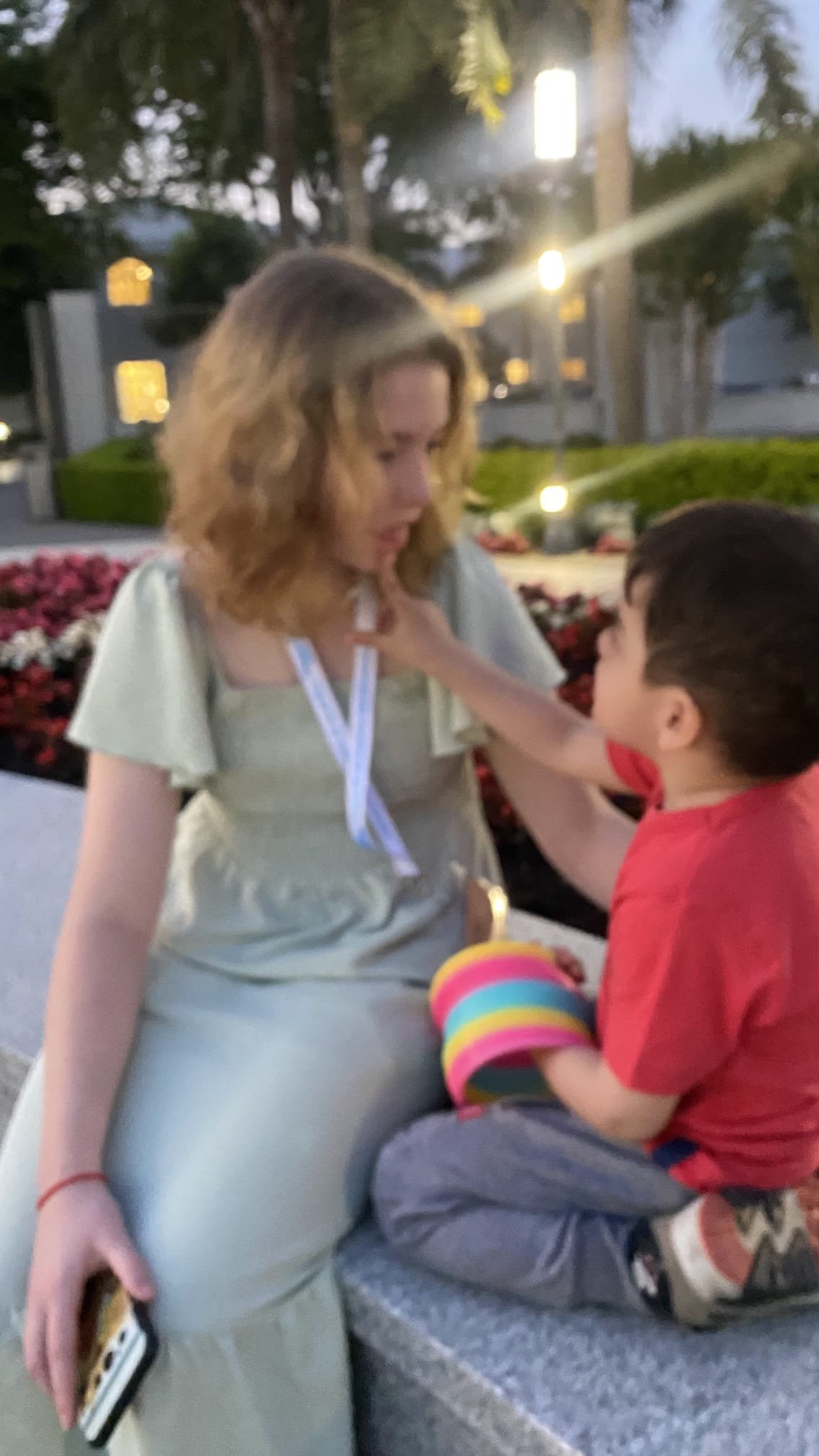 A foundation member interacting warmly with a child during the trip
