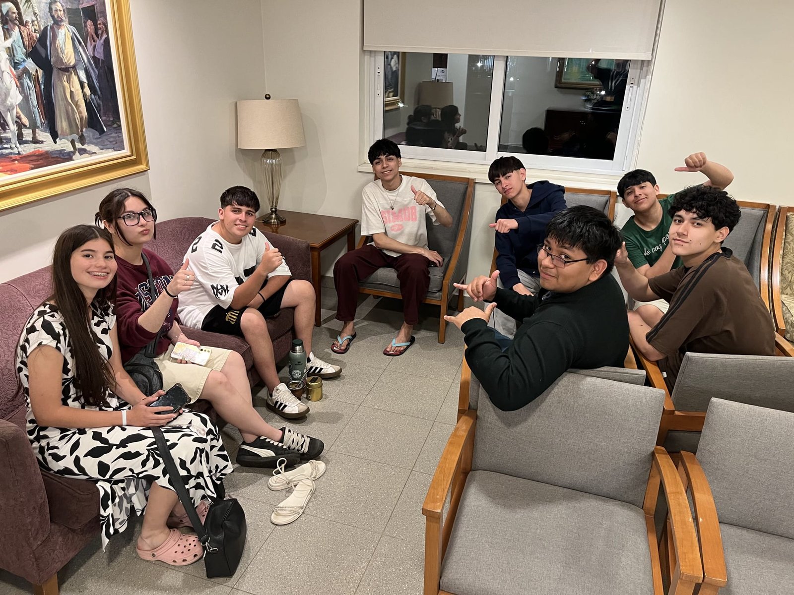 Young members sharing experiences and fellowship at the hostel